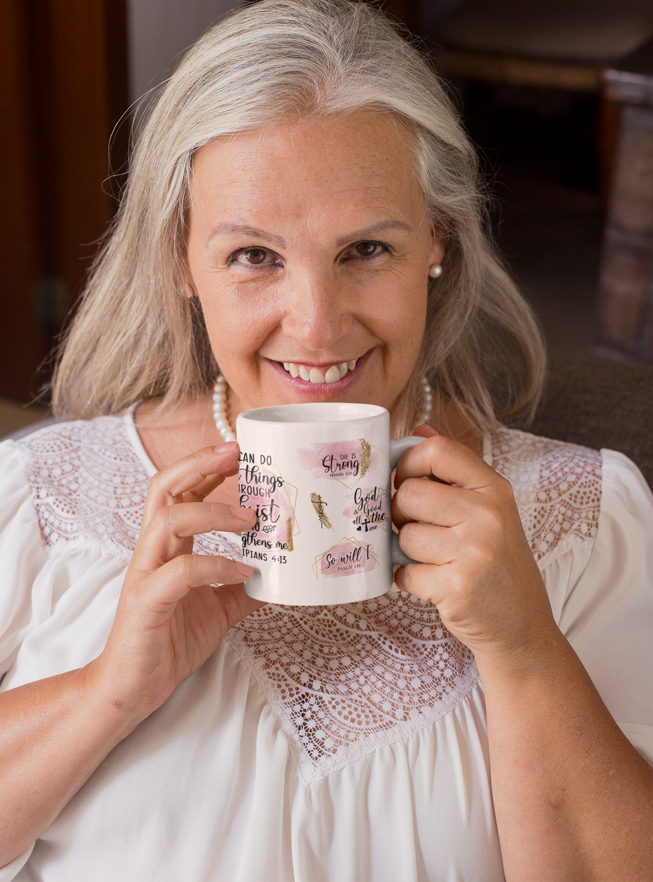 a woman is holding a coffee mug in her hands