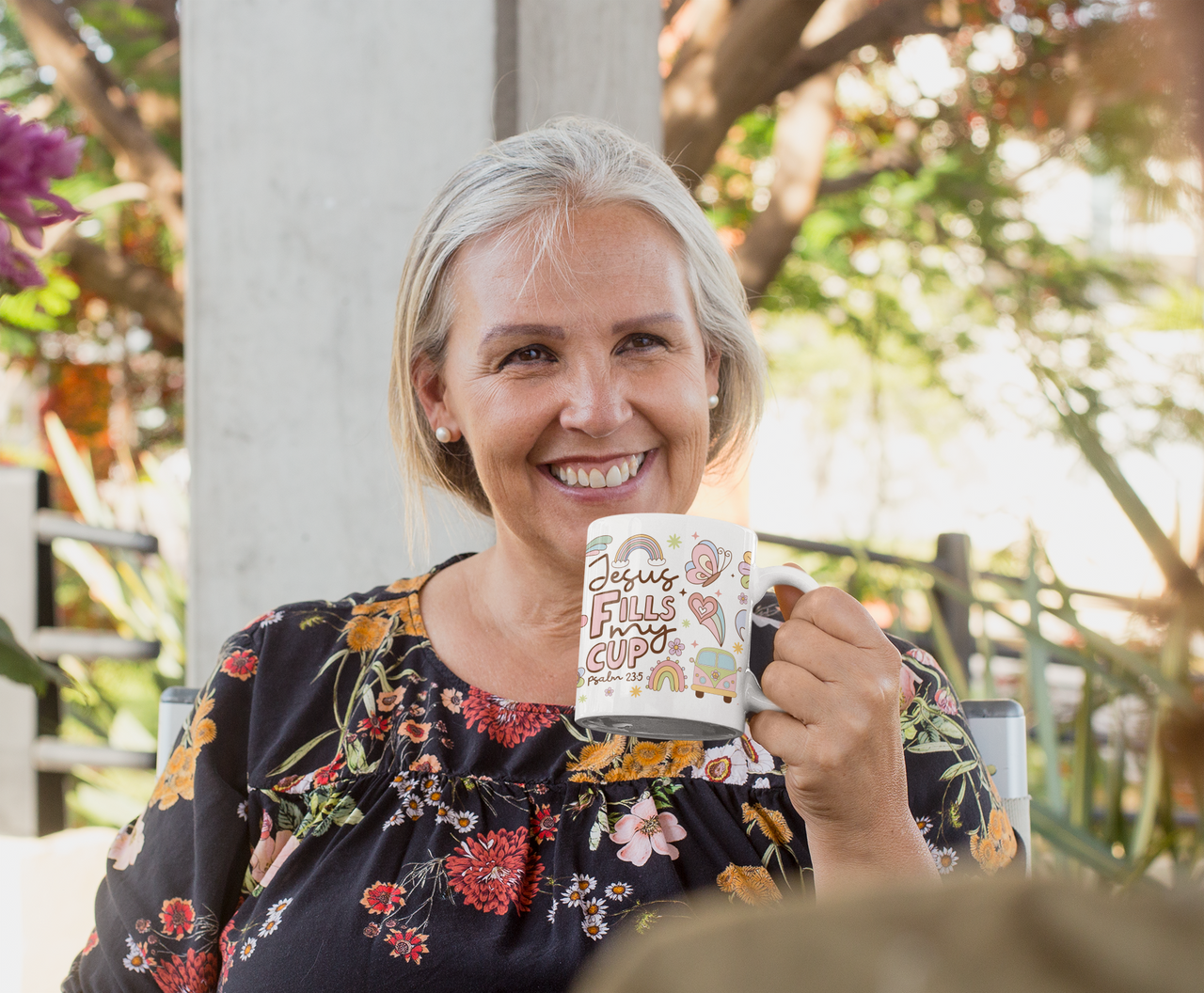 a woman holding a coffee mug in her hands