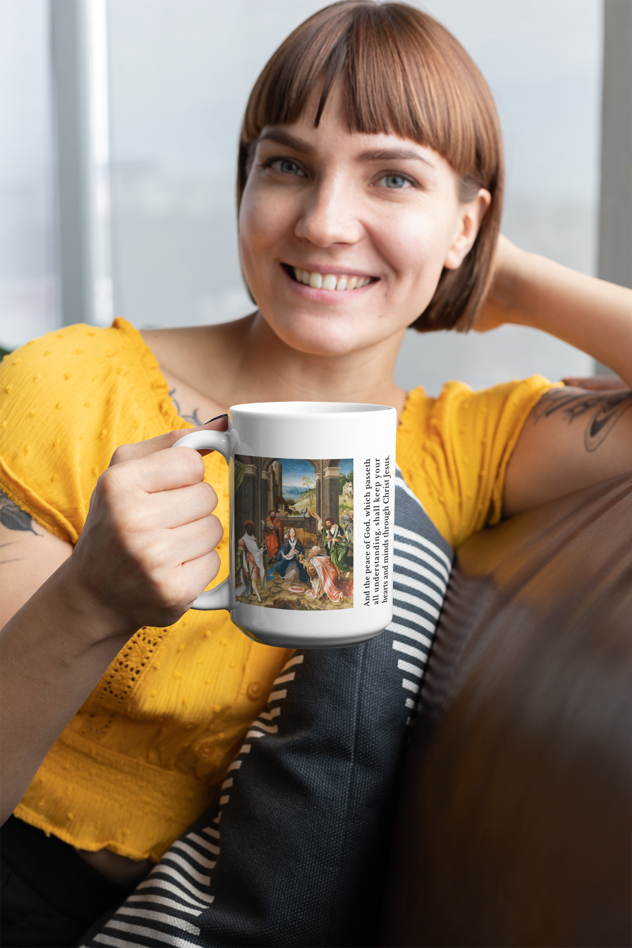 a woman sitting on a couch holding a coffee mug