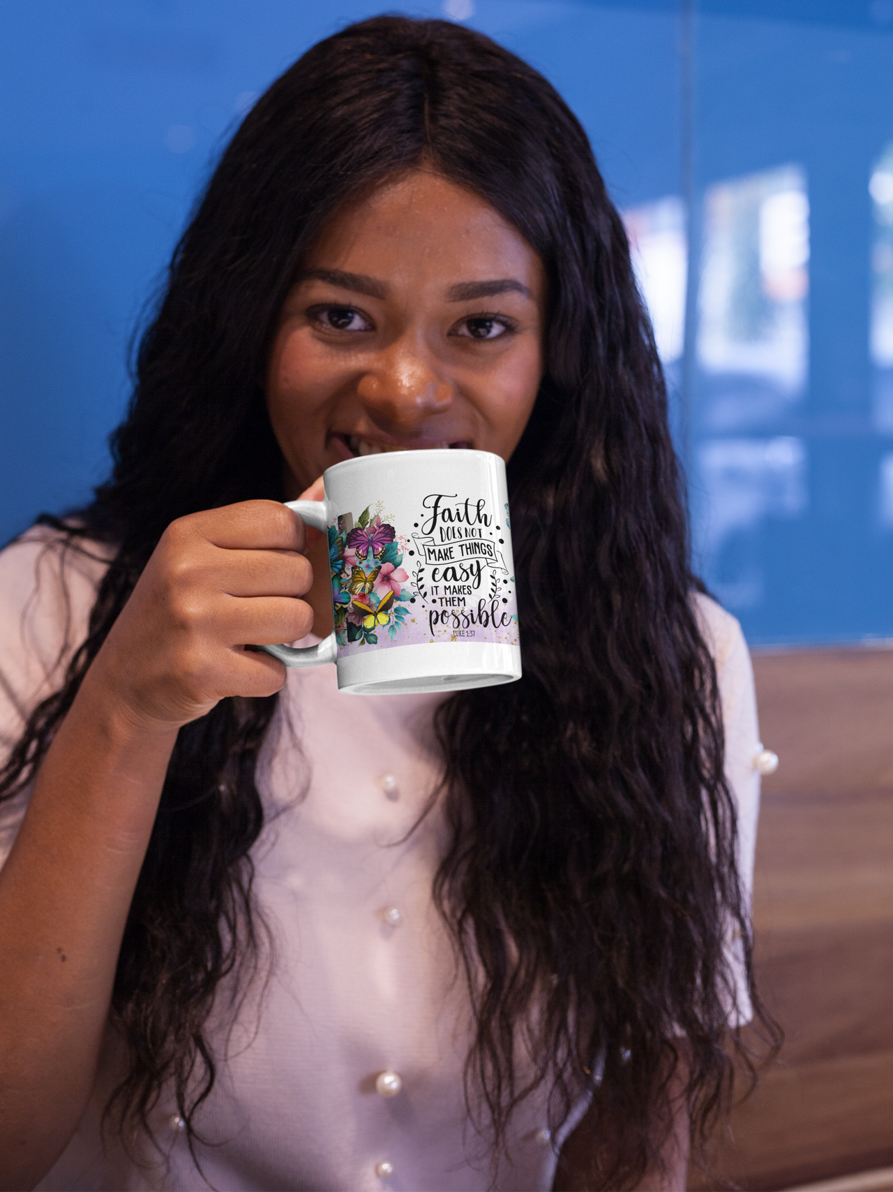 a woman is holding a coffee mug in her hand