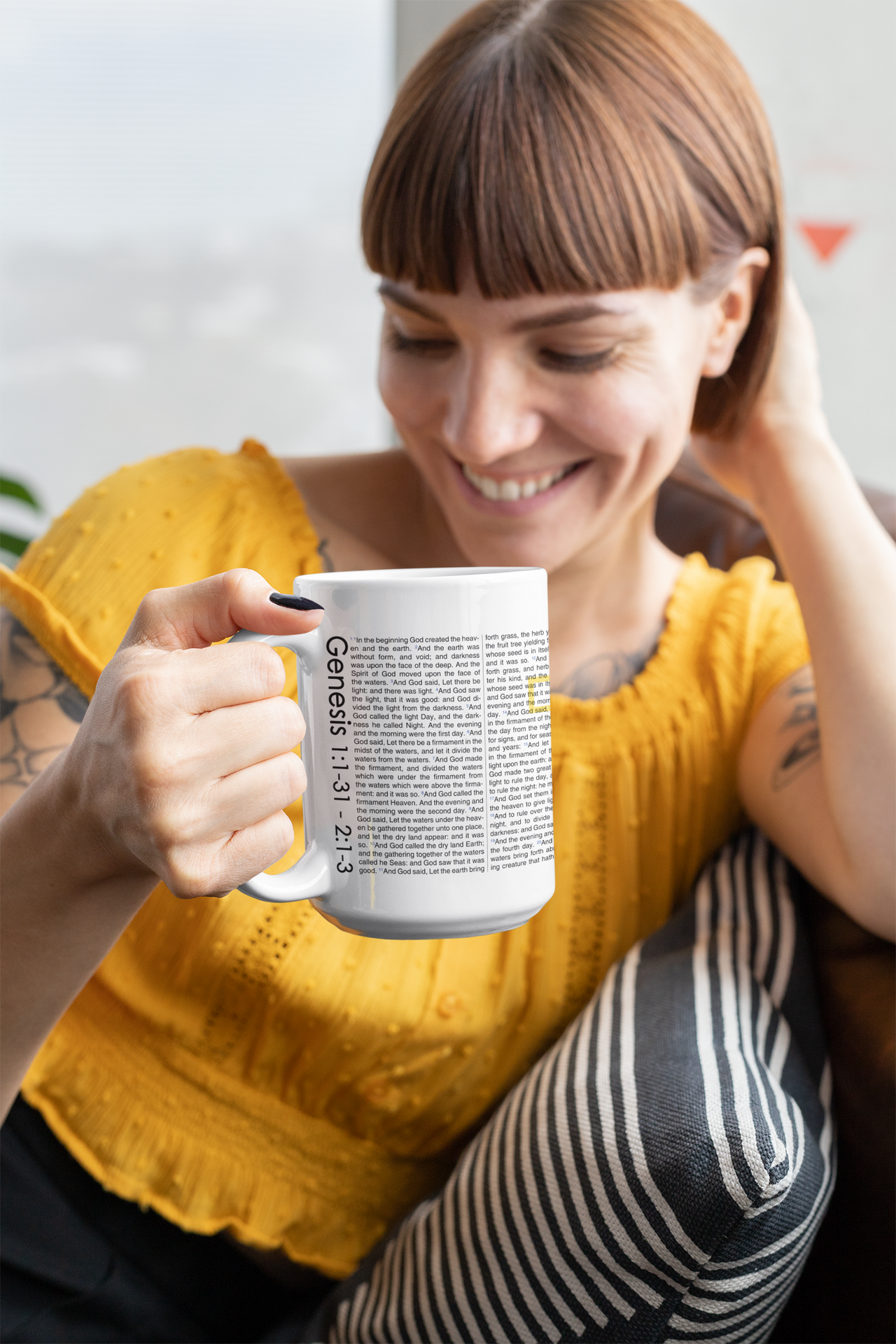 a woman sitting on a couch holding a coffee mug