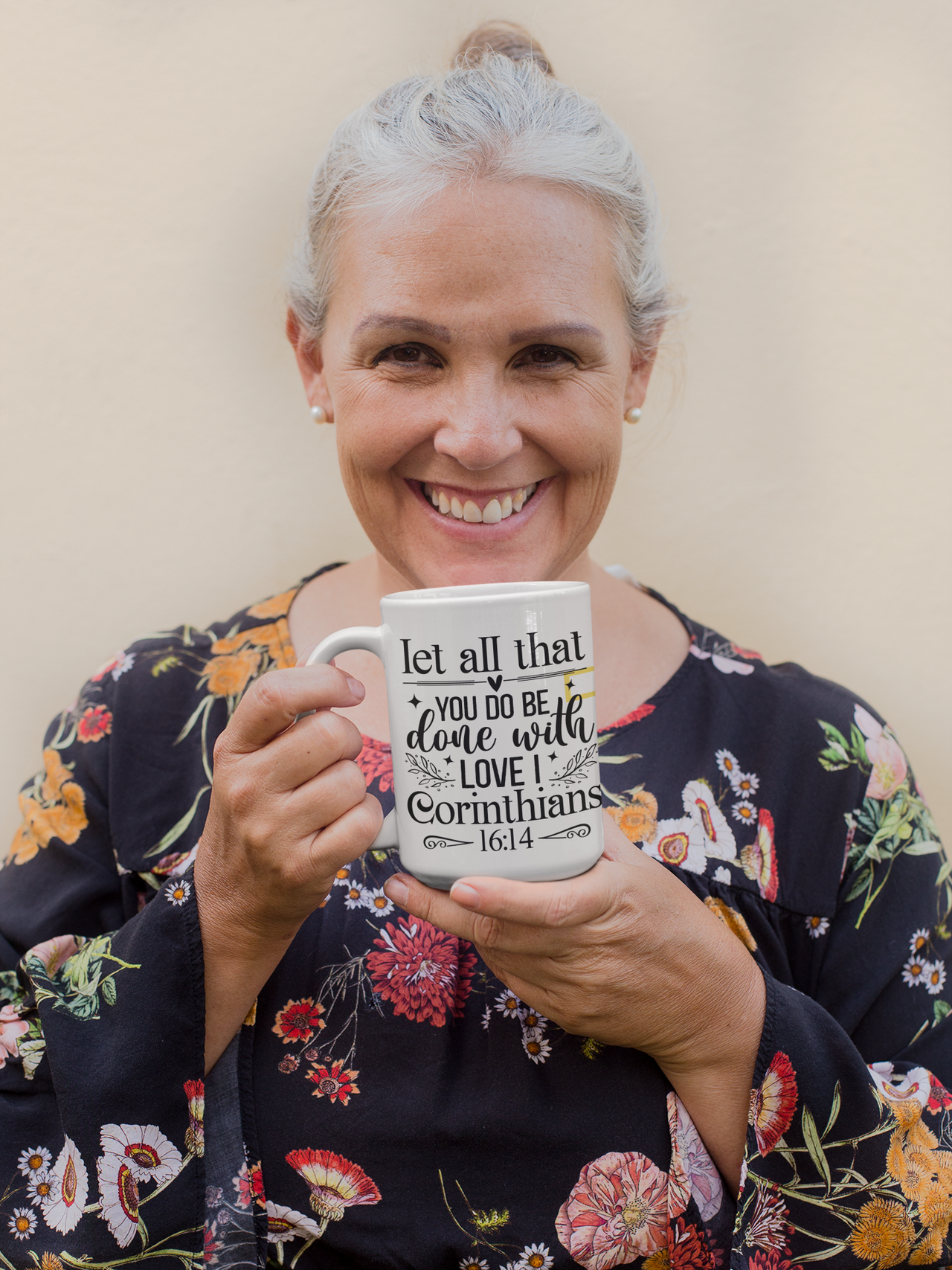 a woman holding a coffee mug with a quote on it