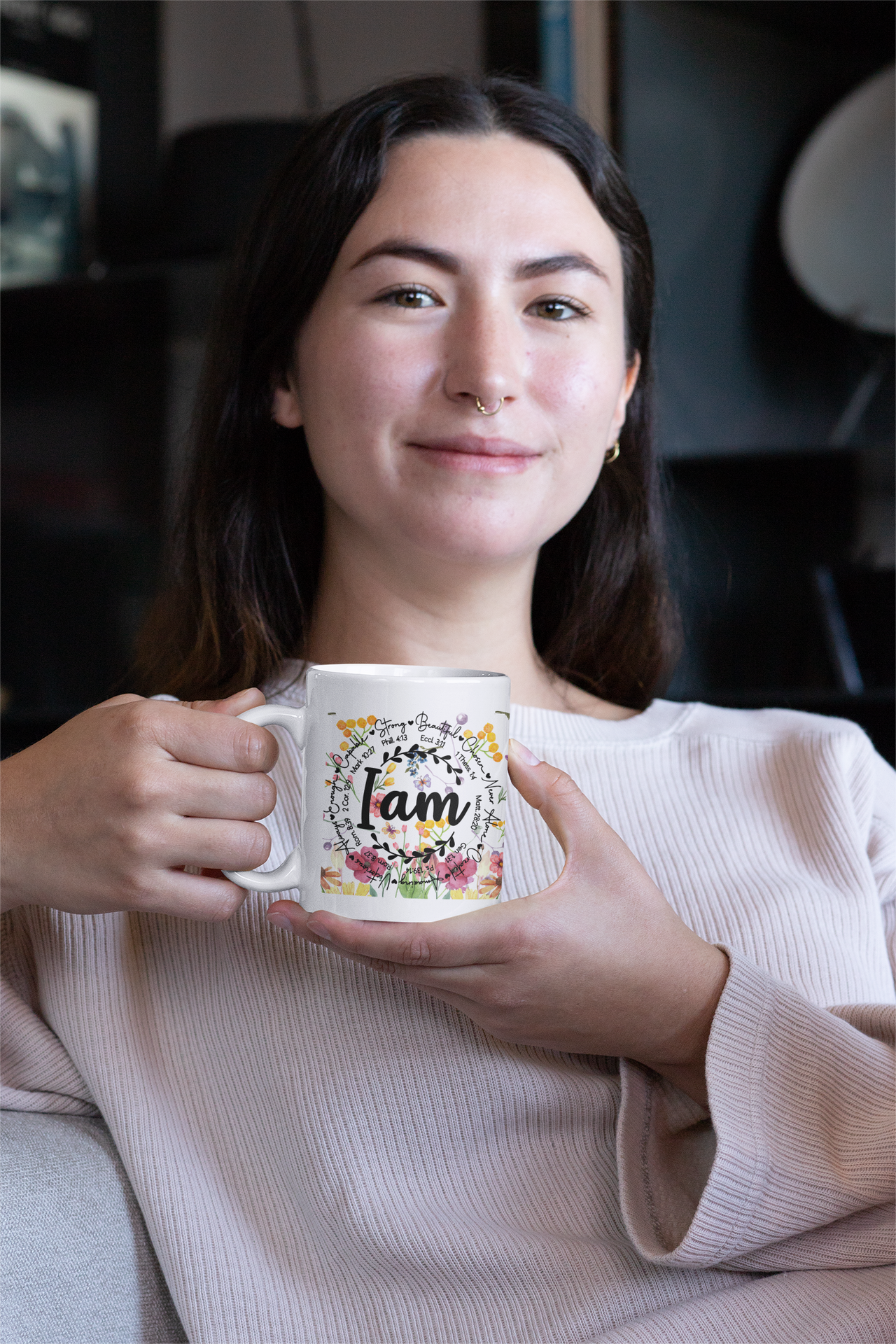 a woman holding a coffee mug in her hands