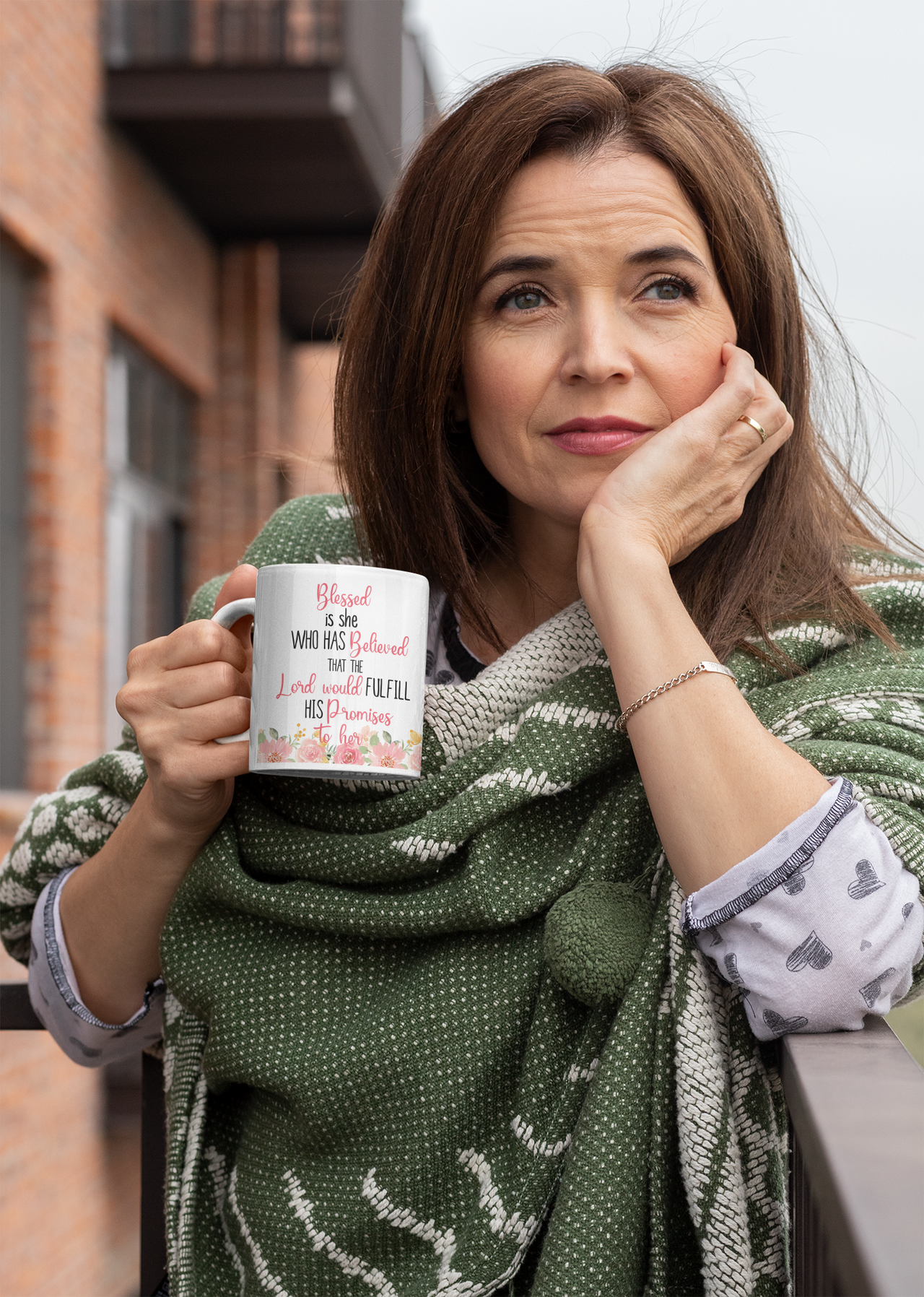 a woman holding a coffee mug in her hands