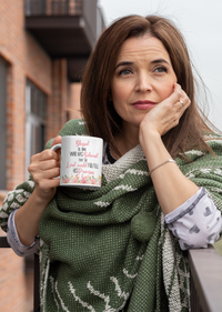 Thumbnail for a woman holding a coffee mug in her hands