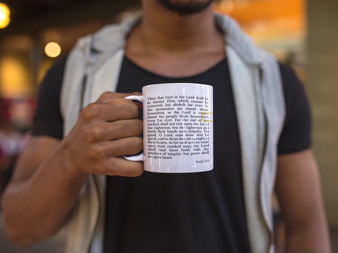 a man holding a coffee mug with a poem on it