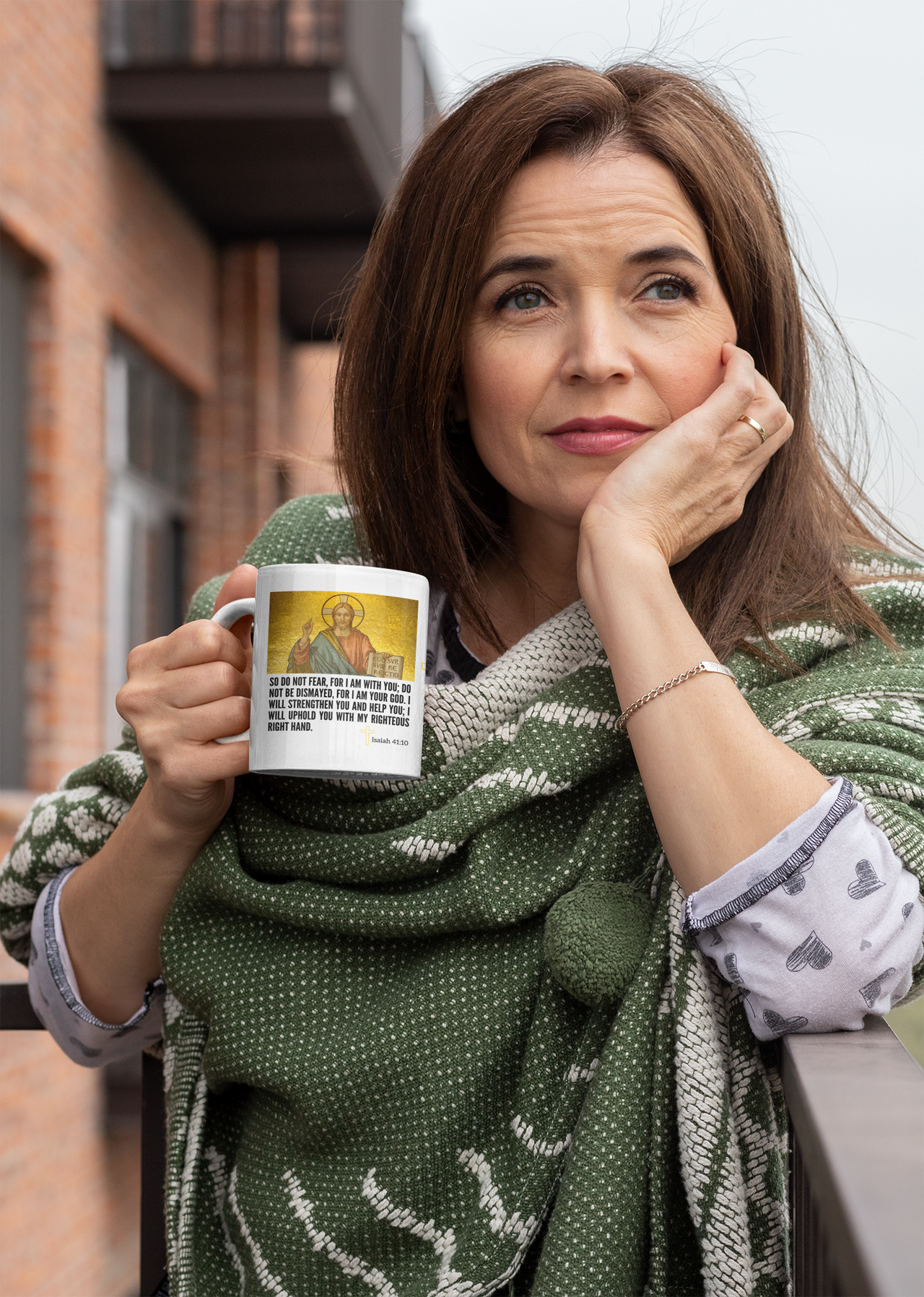 a woman is holding a coffee mug and posing for a picture