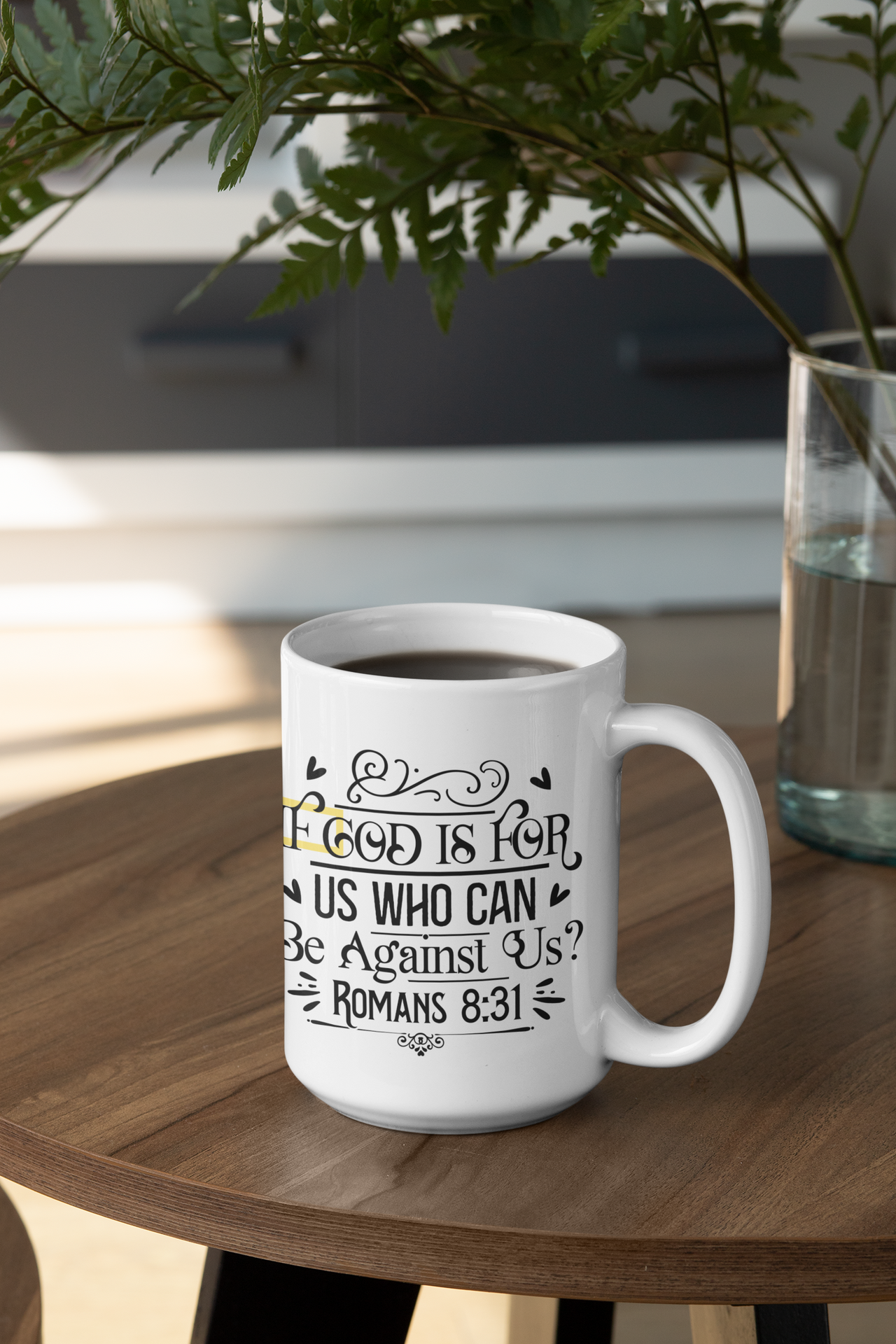 a coffee mug sitting on a table with a plant in the background