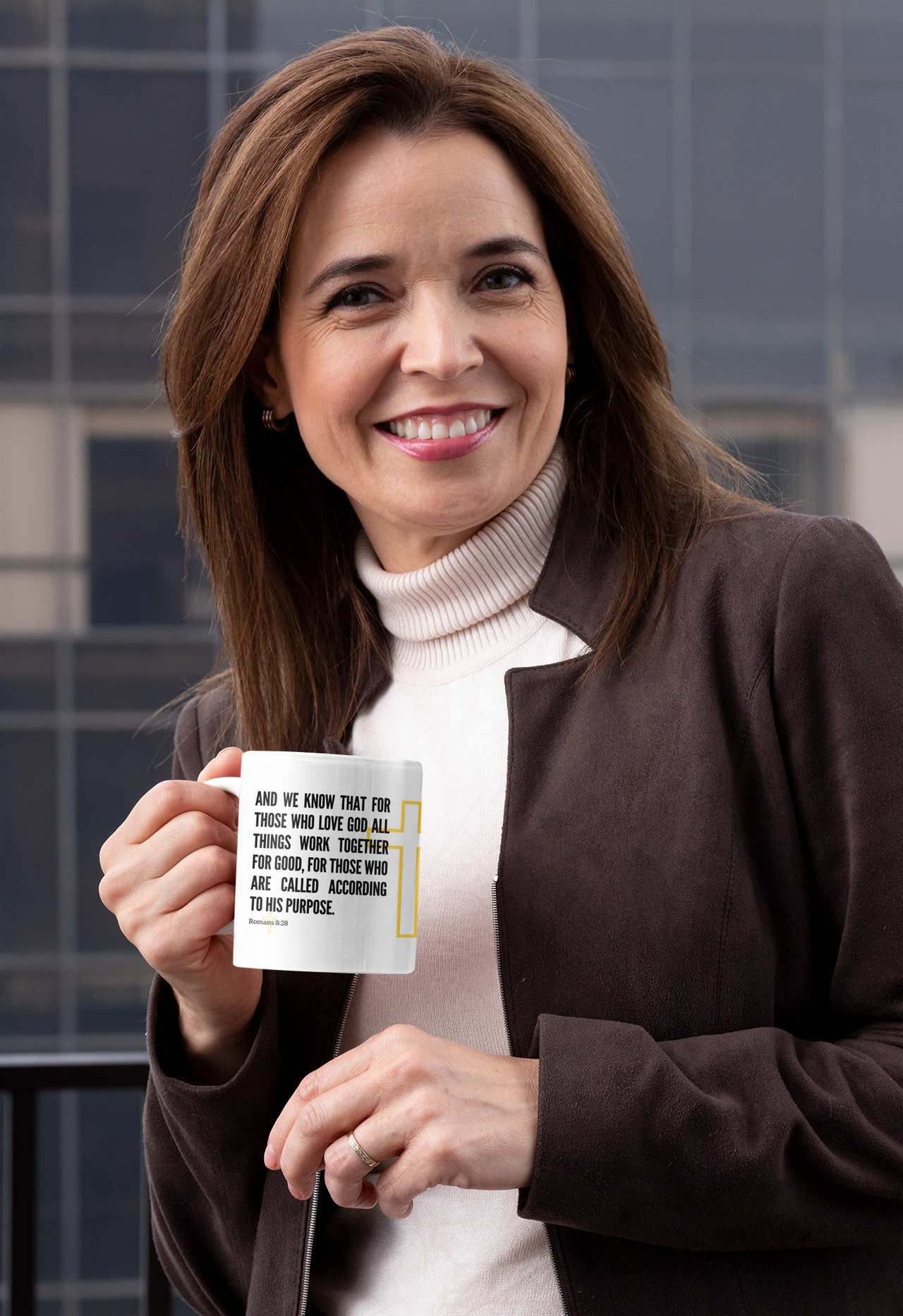 a woman holding a coffee mug with a quote on it