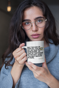 Thumbnail for a woman wearing glasses holding a coffee mug