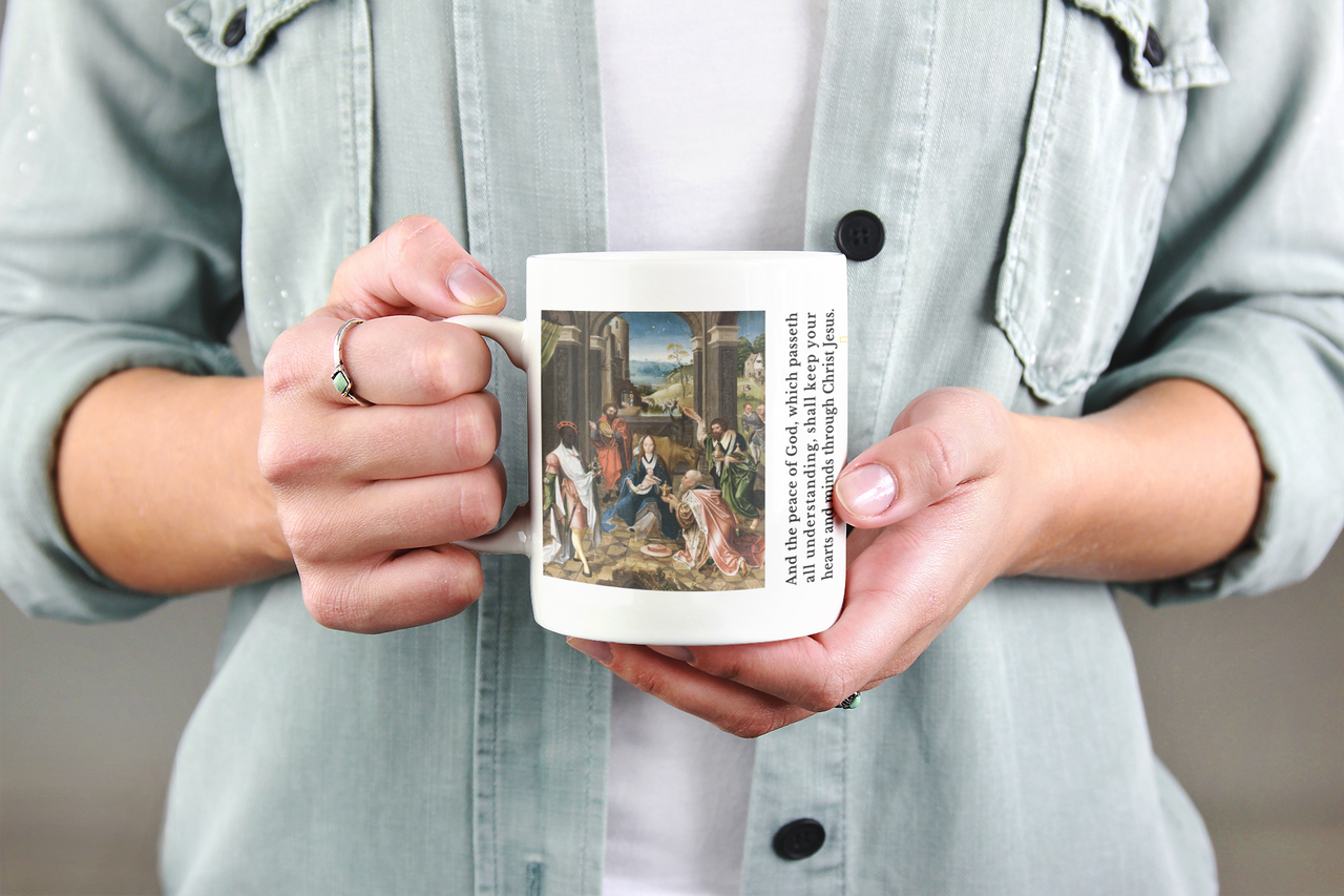 a woman holding a coffee mug with a painting on it