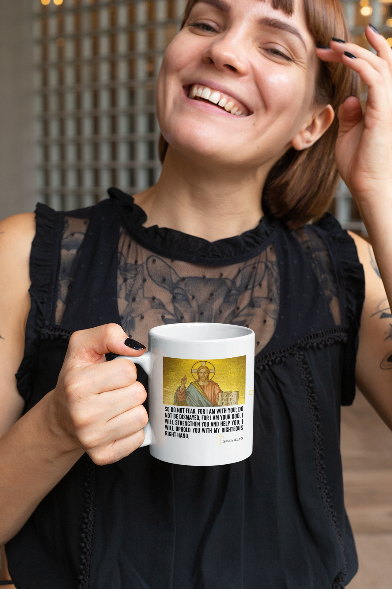 a woman holding a coffee mug with a picture on it