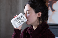 Thumbnail for a woman drinking from a bottle of milk