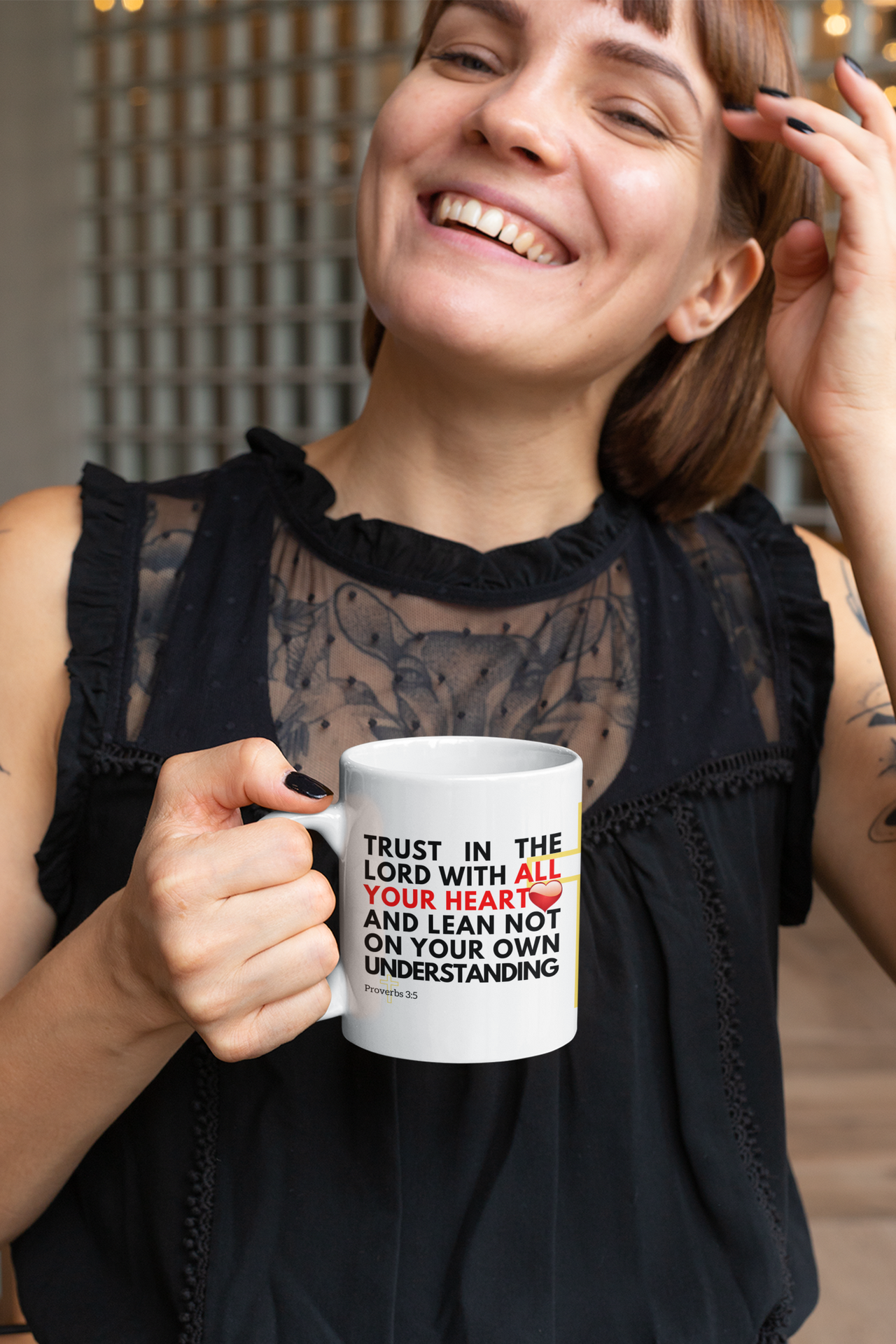 a woman holding a coffee mug in her right hand