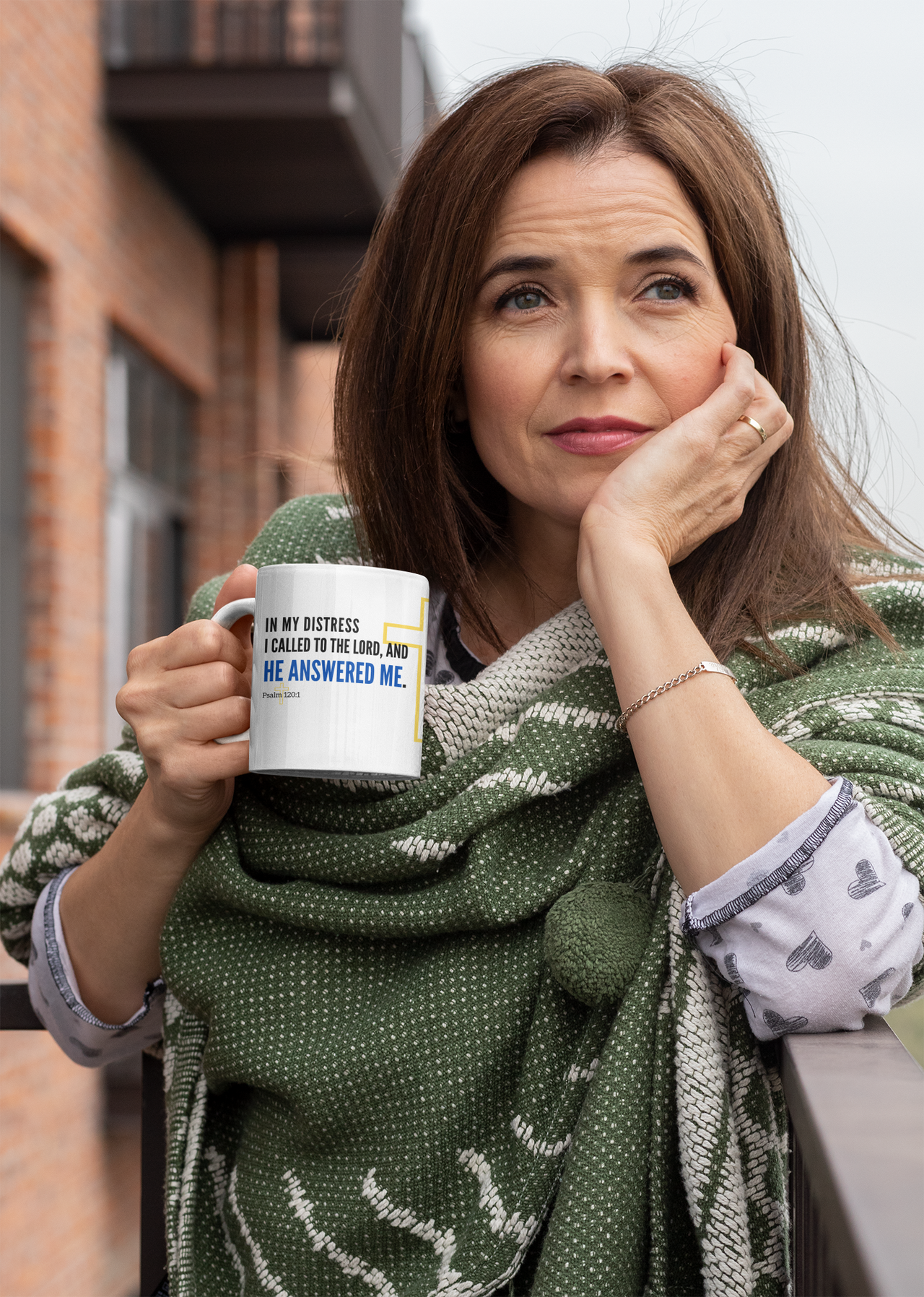 a woman holding a coffee mug in her hands