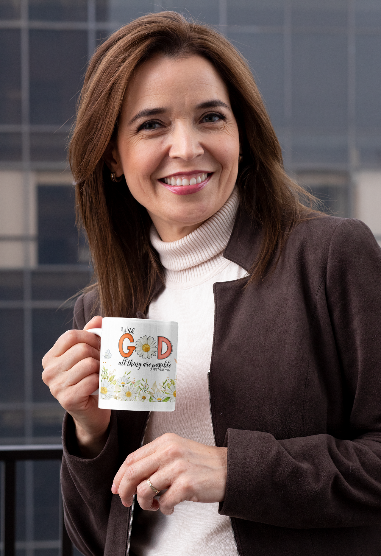 a woman is holding a coffee cup and smiling