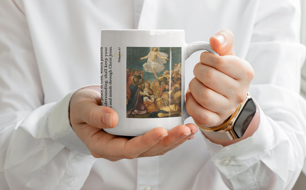 a person holding a coffee mug with a painting on it