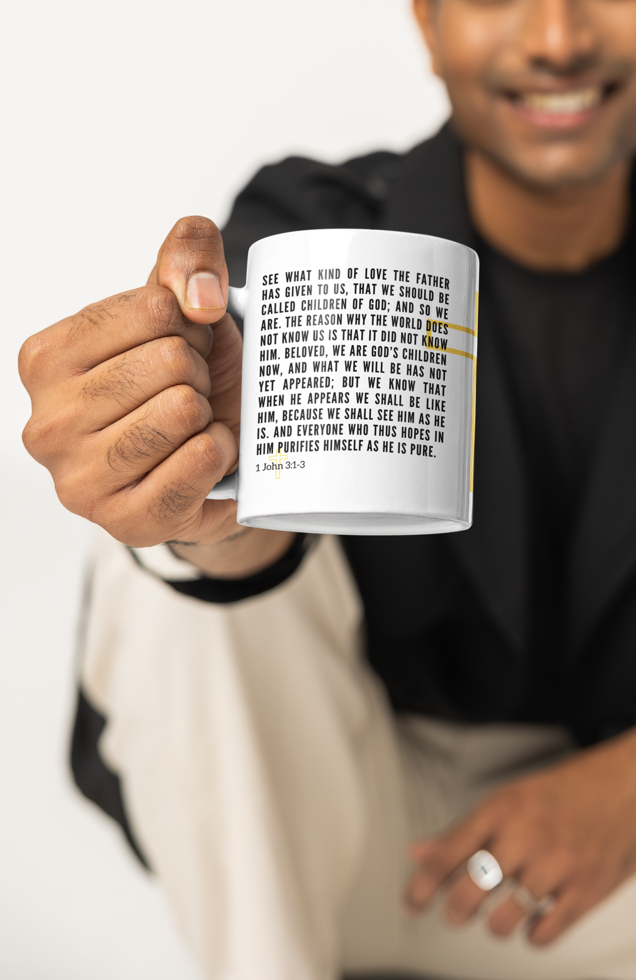 a man holding a coffee mug with a poem on it