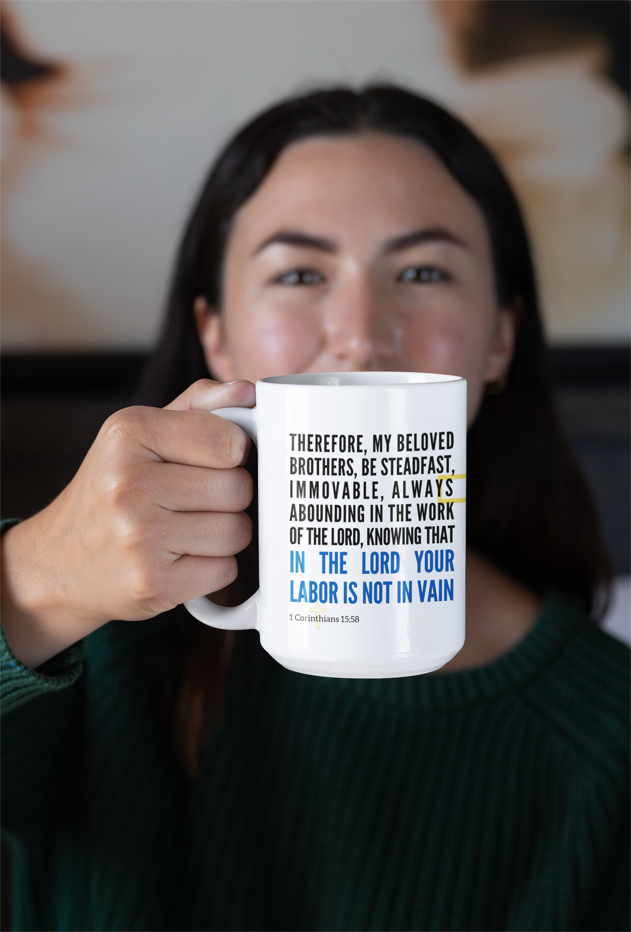 a woman holding a coffee mug with a quote on it