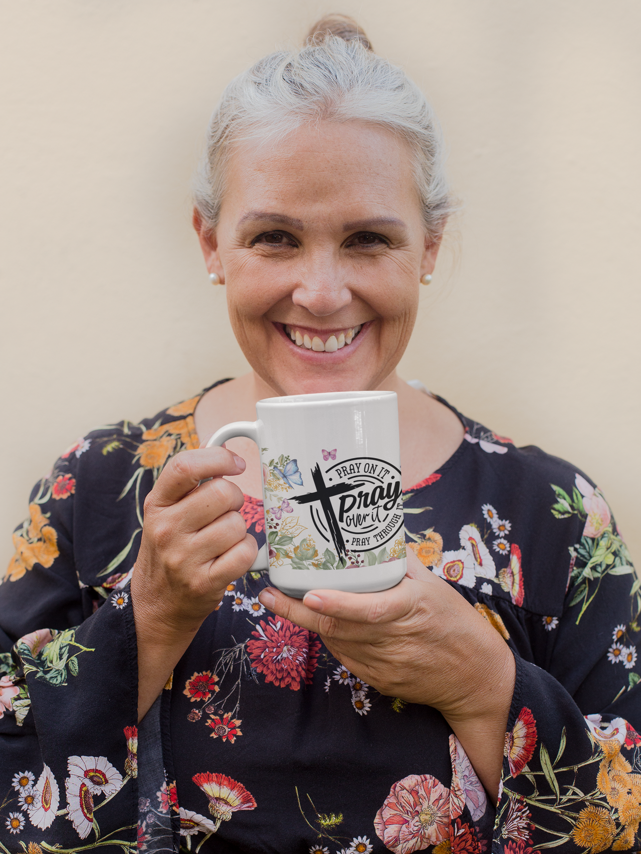 a woman holding a coffee mug in her hands