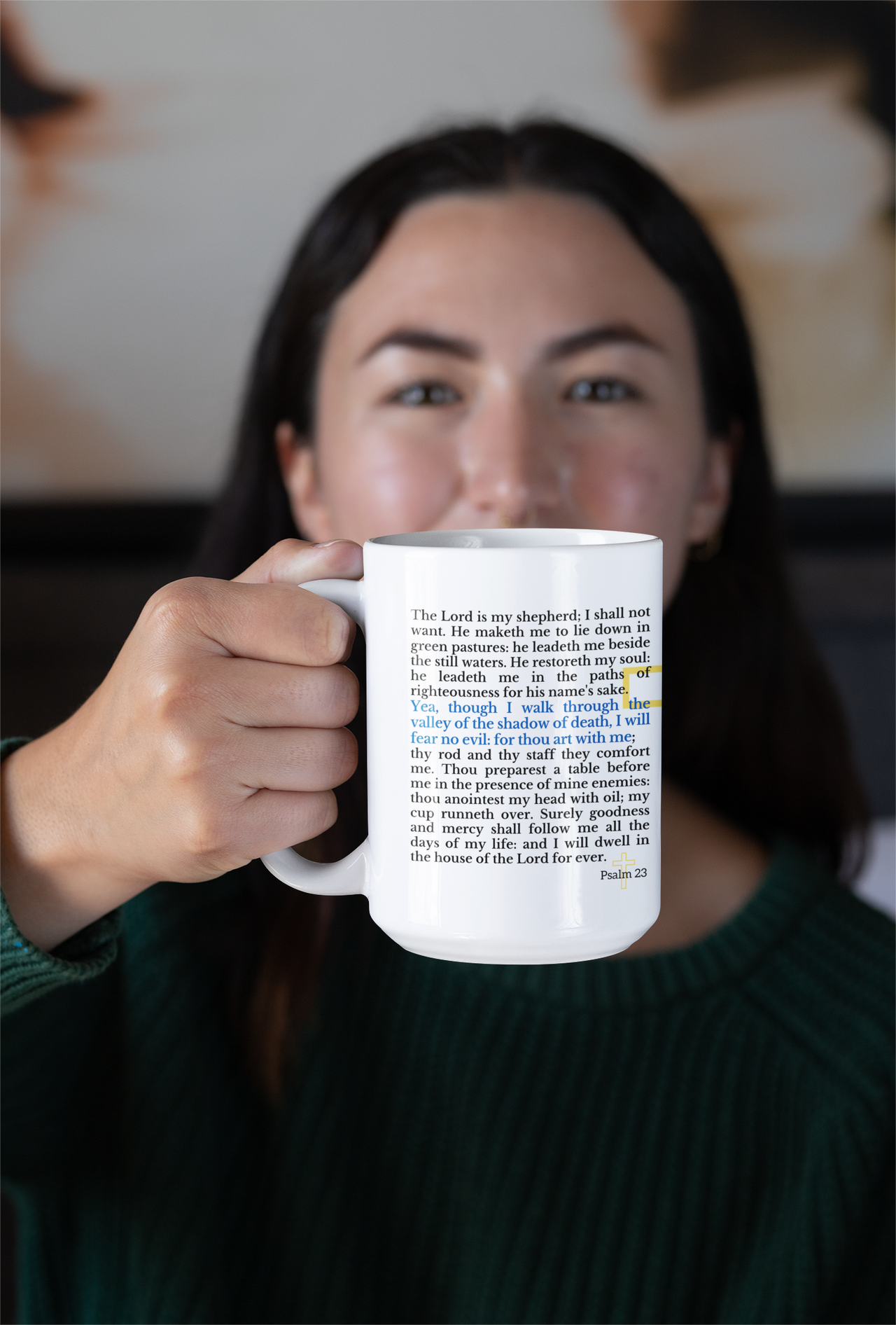 a woman holding a coffee mug with a poem on it