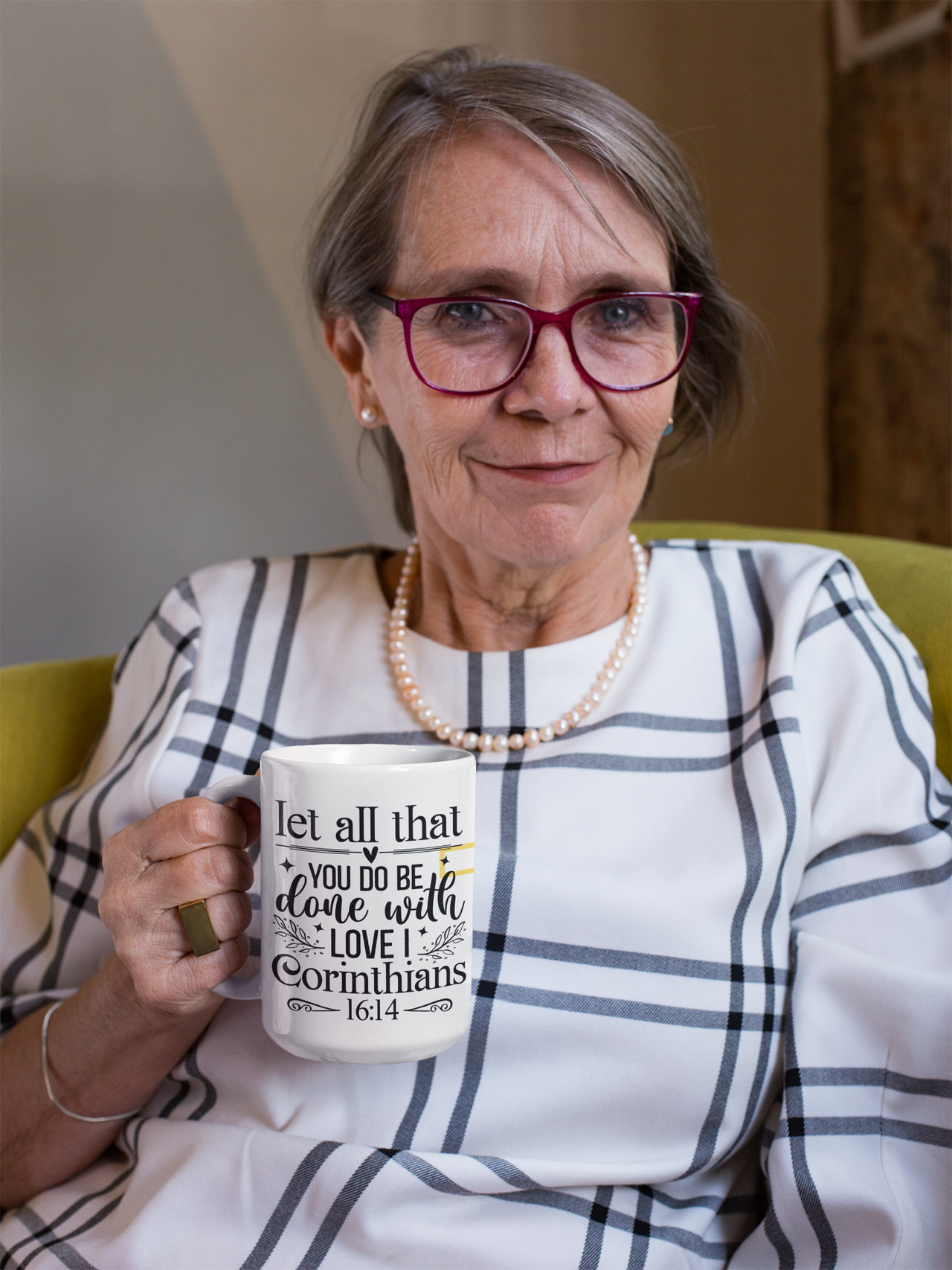 a woman in glasses holding a coffee mug