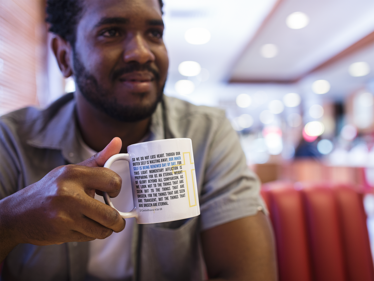 a man holding a coffee mug with a poem on it